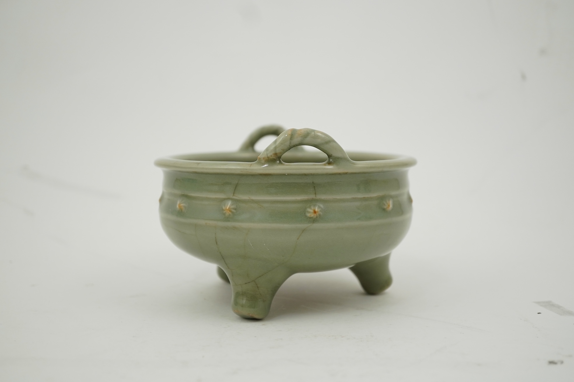 A Chinese Longquan celadon crackle glazed tripod censer, Ming dynasty or later
